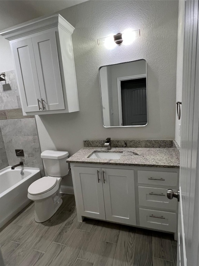 full bathroom with vanity, shower / bathtub combination, and toilet