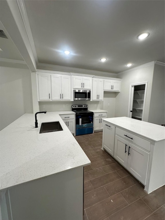 kitchen with light stone counters, crown molding, sink, electric stove, and white cabinets