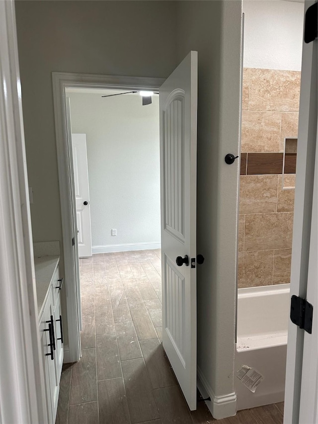 corridor featuring dark hardwood / wood-style flooring