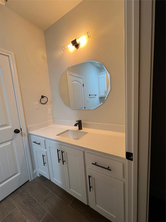 bathroom featuring tile patterned flooring and vanity