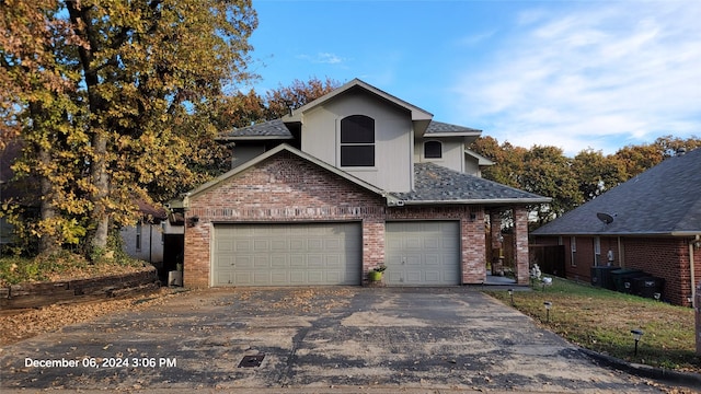 front of property with a garage