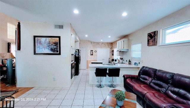 tiled living room with sink