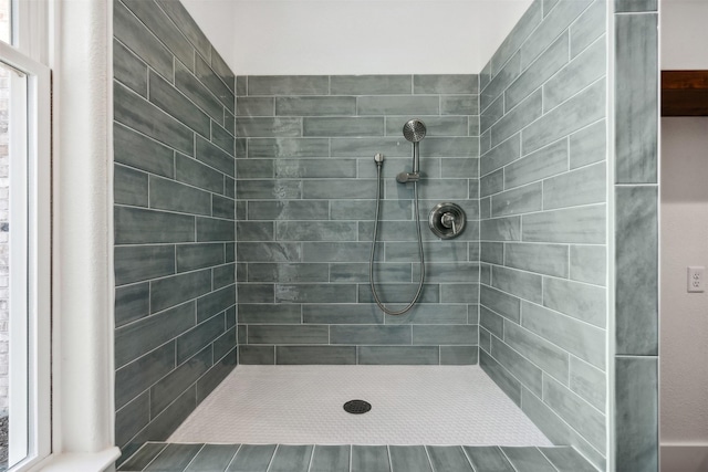 bathroom with a tile shower