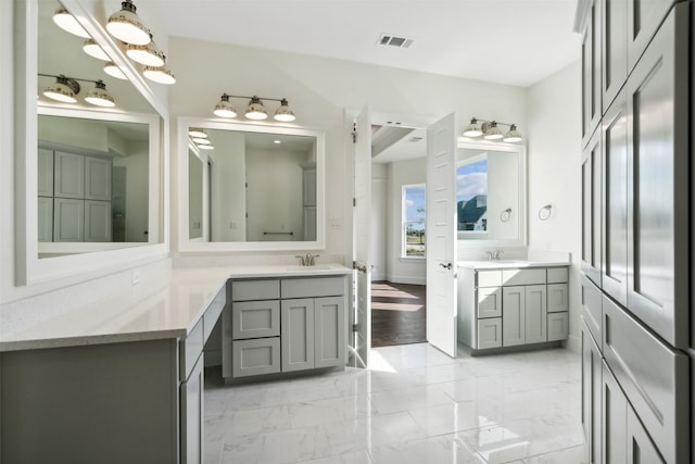 bathroom featuring vanity and hardwood / wood-style flooring