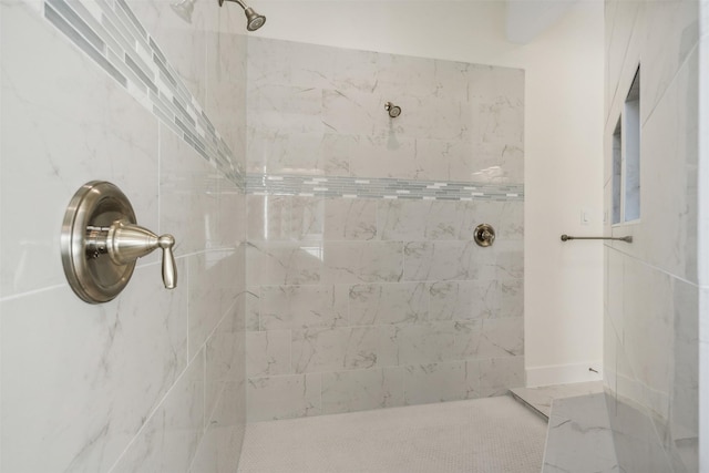 bathroom featuring tiled shower