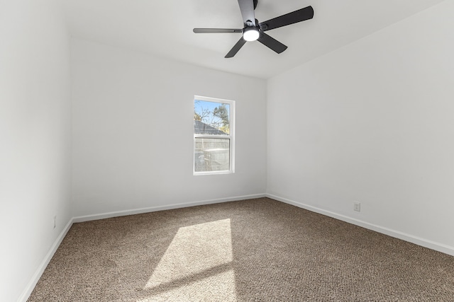 empty room featuring carpet floors and ceiling fan