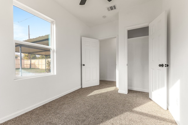 unfurnished bedroom featuring carpet flooring and ceiling fan