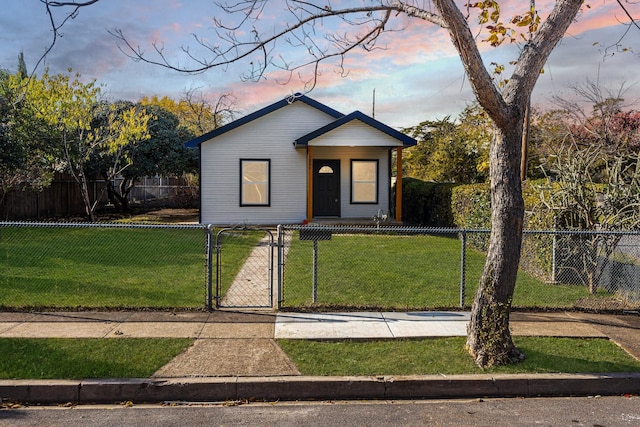 view of front of house with a lawn