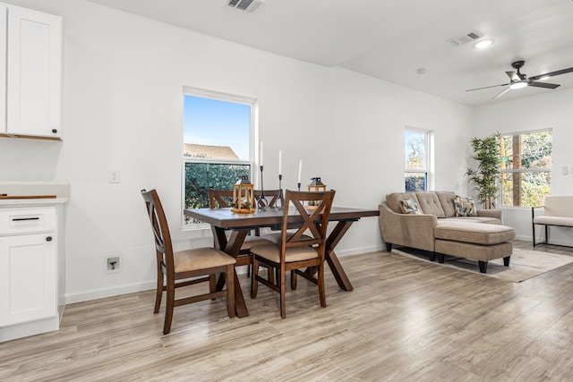 dining space featuring light hardwood / wood-style floors and ceiling fan