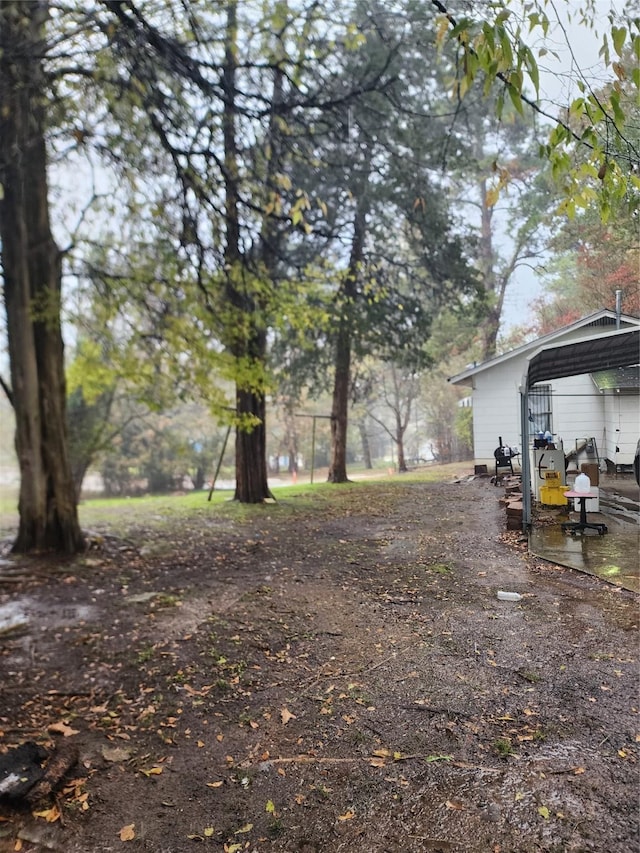 view of yard with a carport