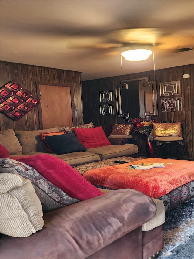 living room with wood walls