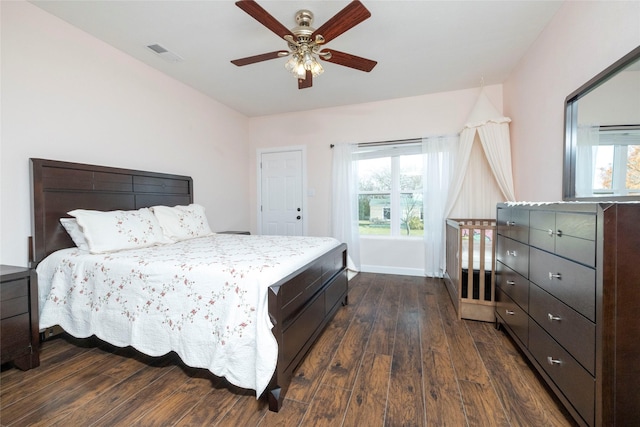 bedroom featuring ceiling fan and dark hardwood / wood-style floors