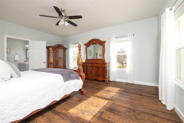 bedroom with ceiling fan, ensuite bathroom, dark hardwood / wood-style floors, and multiple windows