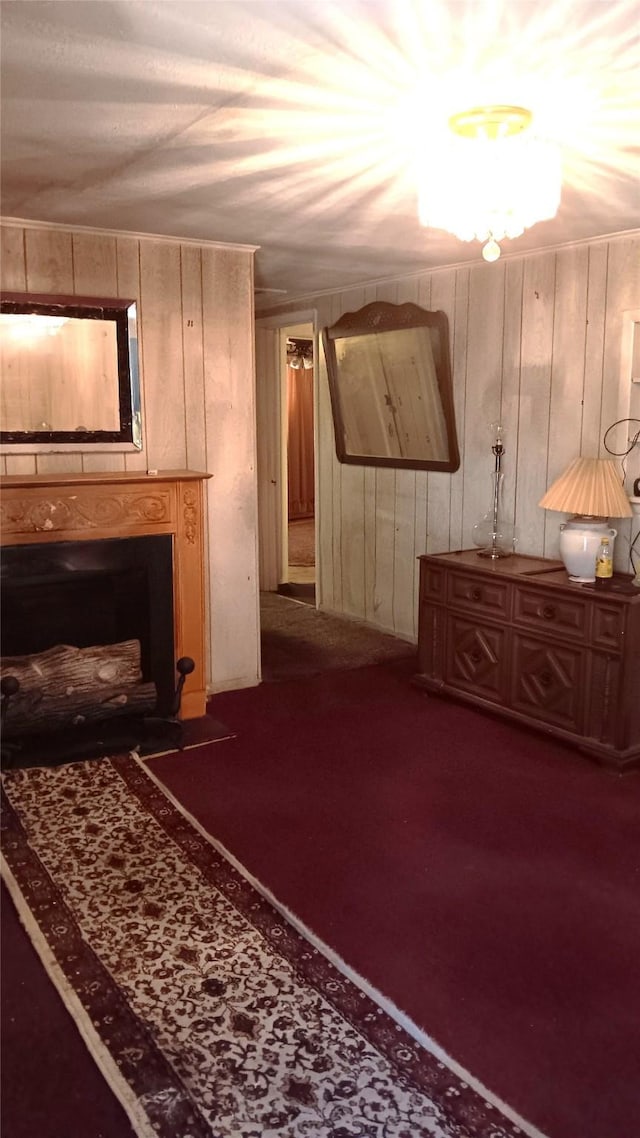 interior space with carpet floors and wood walls