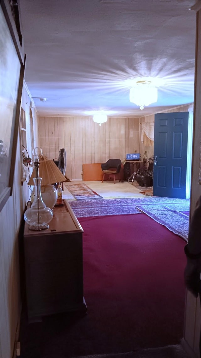 bedroom featuring wooden walls