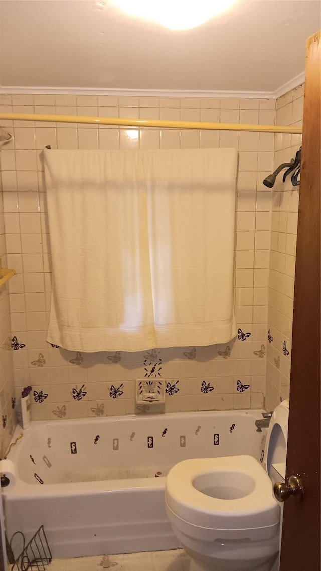 bathroom featuring separate shower and tub, toilet, tile walls, and crown molding