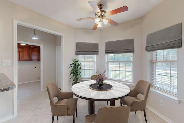 dining room featuring ceiling fan and light tile patterned floors