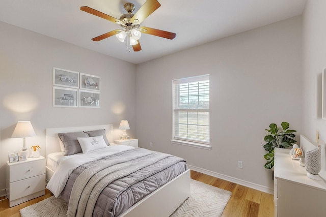 bedroom with ceiling fan and light wood-type flooring