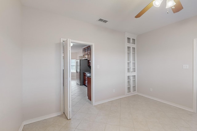 unfurnished room with ceiling fan