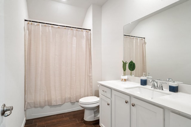 full bathroom with vanity, toilet, wood-type flooring, and shower / tub combo with curtain