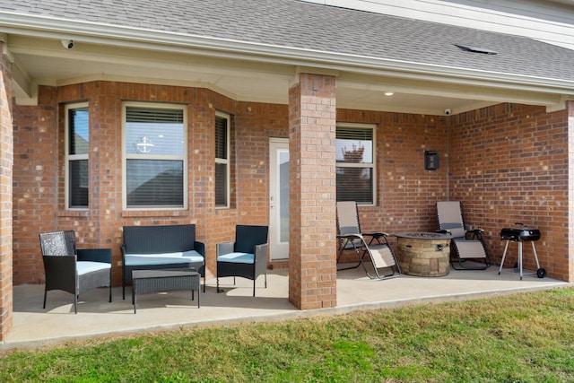 view of patio / terrace with an outdoor fire pit