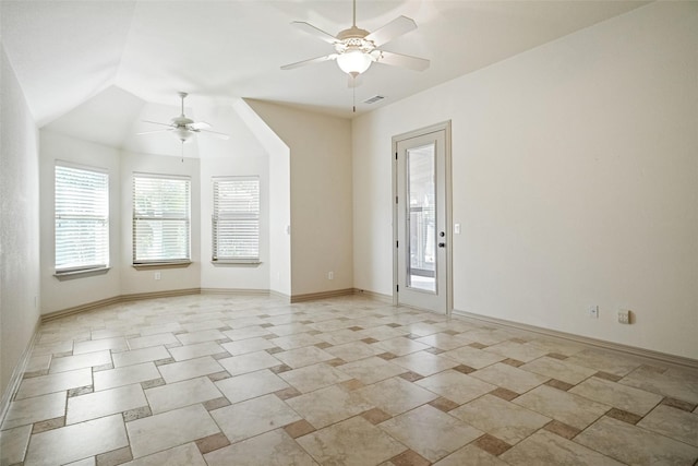 empty room featuring ceiling fan and vaulted ceiling