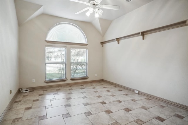 unfurnished room featuring lofted ceiling and ceiling fan