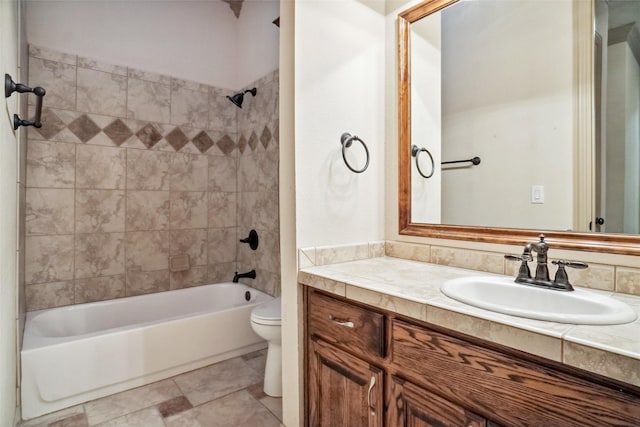 full bathroom with vanity, toilet, and tiled shower / bath