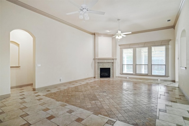 unfurnished living room with ceiling fan and ornamental molding