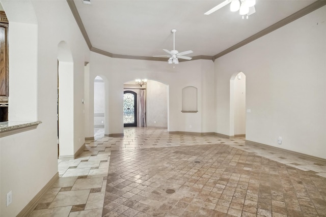 unfurnished living room featuring ceiling fan and ornamental molding