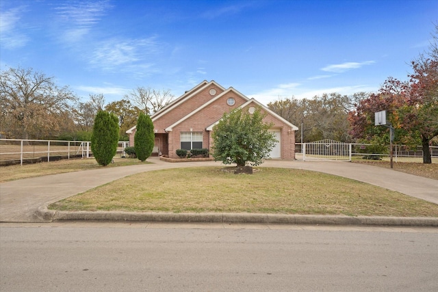 view of front of house with a garage and a front lawn