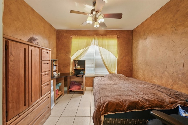 tiled bedroom featuring ceiling fan