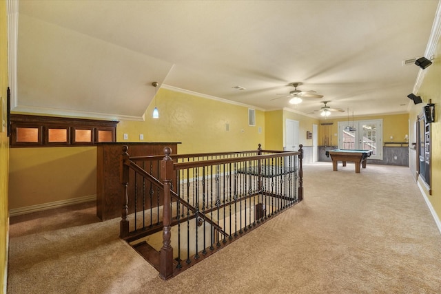 interior space with ornamental molding and carpet