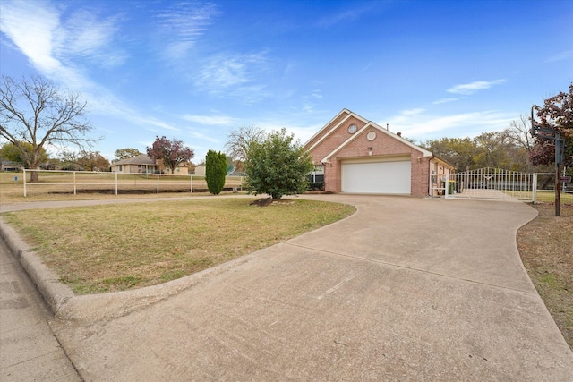 view of front of house featuring a garage and a front lawn