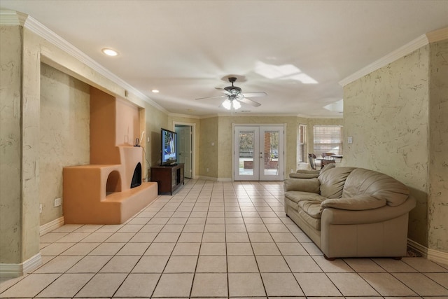 tiled living room featuring french doors, ceiling fan, and crown molding