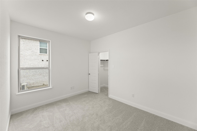 unfurnished bedroom featuring light colored carpet