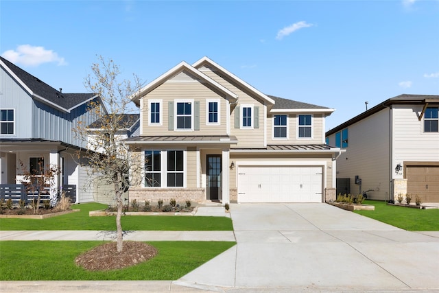 craftsman-style house featuring a front yard and a garage