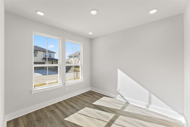 empty room with wood-type flooring