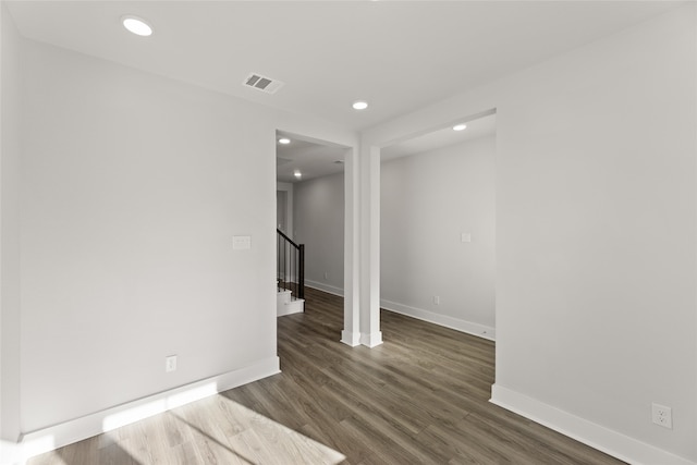 unfurnished room featuring dark hardwood / wood-style flooring