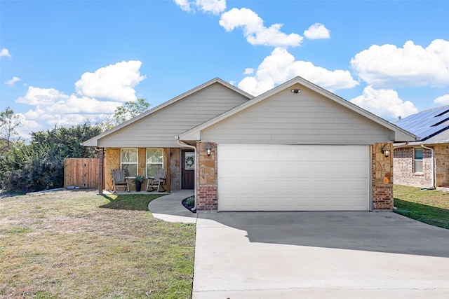 view of front of house featuring a garage and a front yard