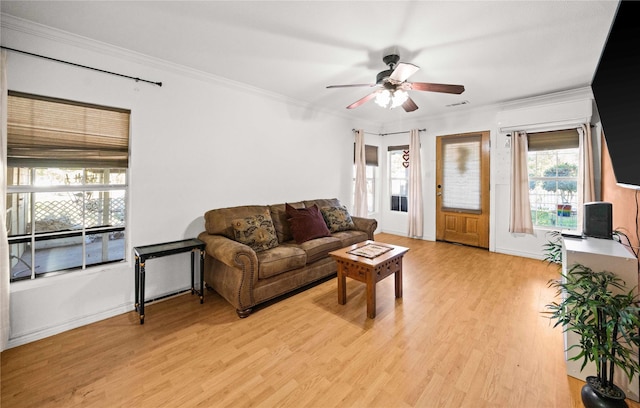 living room featuring crown molding, ceiling fan, and light wood-type flooring