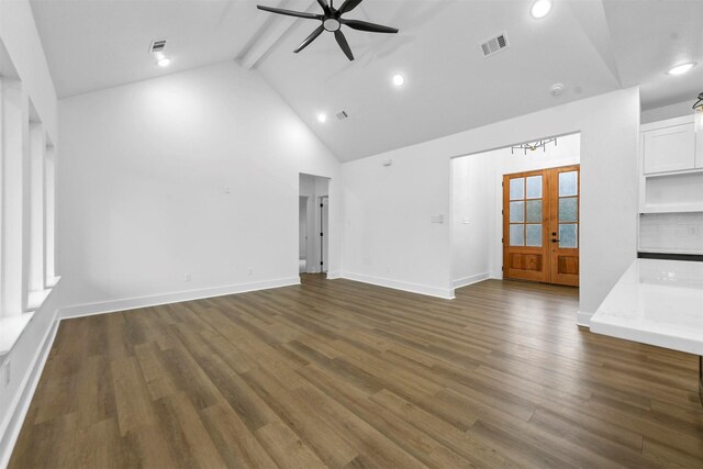 unfurnished living room featuring high vaulted ceiling, french doors, dark hardwood / wood-style floors, ceiling fan, and beamed ceiling