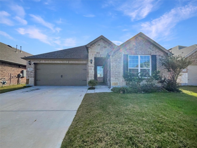 view of front of house with a garage and a front lawn