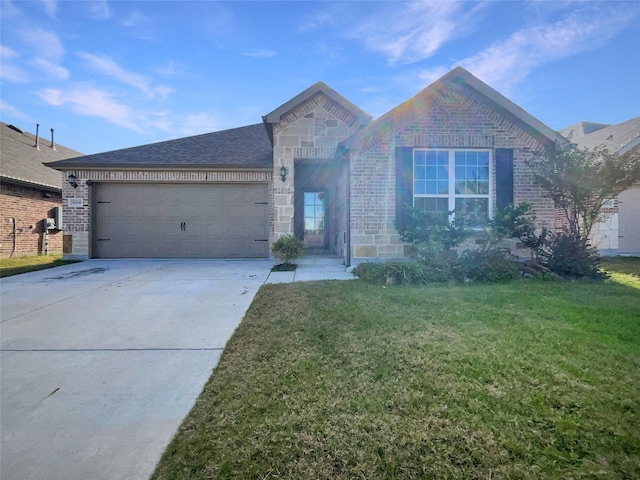 view of front of house featuring a garage and a front lawn