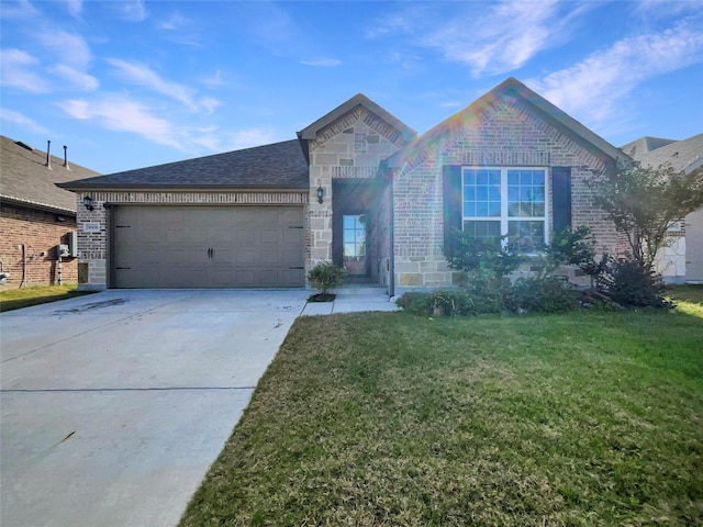 view of front facade featuring a garage and a front lawn