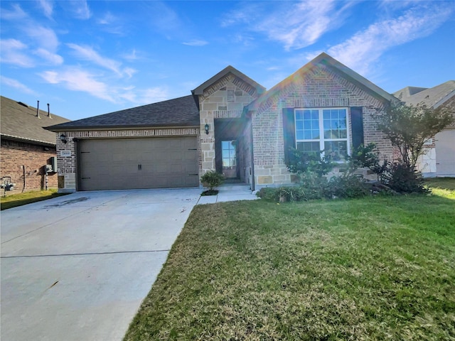 view of front of home featuring a garage and a front lawn