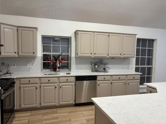 kitchen with sink, dishwasher, black electric range, backsplash, and light wood-type flooring