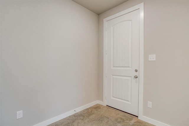 unfurnished room featuring light carpet