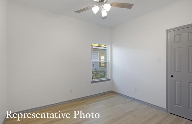 empty room featuring ceiling fan and light hardwood / wood-style flooring