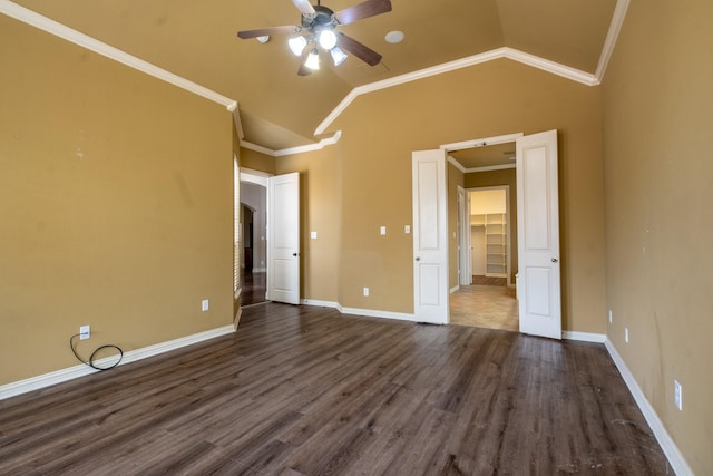 unfurnished bedroom featuring crown molding, ceiling fan, dark hardwood / wood-style floors, and vaulted ceiling